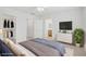 Serene main bedroom features a comfortable bed, closet, and an ensuite bathroom, virtually staged at 3621 Arcadian Sea St, Las Vegas, NV 89106