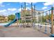 Community playground area with modern climbing equipment and a slide at 3621 Arcadian Sea St, Las Vegas, NV 89106