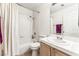 Clean bathroom features a shower-tub combo, white tile, and wood-finish vanity at 3673 Ian Thomas St # 201, Las Vegas, NV 89129