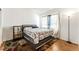 Cozy bedroom with wood flooring, modern furnishings, and soft natural lighting at 3673 Ian Thomas St # 201, Las Vegas, NV 89129