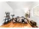 Bright bedroom with wood floors, exercise equipment, and modern décor at 3673 Ian Thomas St # 201, Las Vegas, NV 89129