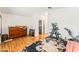 Bright bedroom with wood floors, dresser and view to walk-in closet at 3673 Ian Thomas St # 201, Las Vegas, NV 89129