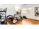 Bedroom featuring wood floors, a window with natural light, and decorative art at 3673 Ian Thomas St # 201, Las Vegas, NV 89129