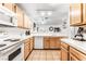 Bright kitchen featuring wooden cabinetry, white countertops, and stainless-steel appliances at 3673 Ian Thomas St # 201, Las Vegas, NV 89129