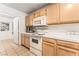 Efficient kitchen layout featuring modern appliances, tiled floors, and ample storage at 3673 Ian Thomas St # 201, Las Vegas, NV 89129