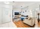 Inviting living room with wood floors, plush furniture, and ample natural light at 3673 Ian Thomas St # 201, Las Vegas, NV 89129
