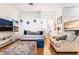 Spacious living room with wood floors, cozy seating, and a bright, open layout at 3673 Ian Thomas St # 201, Las Vegas, NV 89129