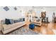 Comfortable living room with hardwood floors, stylish decor, and an open-concept design at 3673 Ian Thomas St # 201, Las Vegas, NV 89129