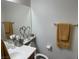 Cozy bathroom with a single vanity, decorative accents, and fresh towels for a clean and inviting space at 3712 Garnet Heights Ave, North Las Vegas, NV 89081