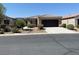 Charming single-story home with desert landscaping, a driveway and a two-car garage at 3712 Garnet Heights Ave, North Las Vegas, NV 89081