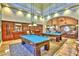 Luxurious game room with two pool tables, bar area, and comfortable seating creates a fun social space at 3712 Garnet Heights Ave, North Las Vegas, NV 89081
