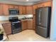 Modern kitchen featuring stainless steel appliances, granite countertops, and ample cabinet space at 3712 Garnet Heights Ave, North Las Vegas, NV 89081