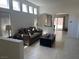 Bright living room featuring tile floors, high ceilings, and arched doorways to other rooms at 3712 Garnet Heights Ave, North Las Vegas, NV 89081