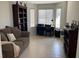Cozy living space with a comfortable sofa, built-in shelving, and natural light from the window at 3712 Garnet Heights Ave, North Las Vegas, NV 89081