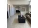 Open-concept living area with tile floors and lots of natural light perfect for Gathering gatherings at 3712 Garnet Heights Ave, North Las Vegas, NV 89081