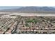 Panoramic aerial view showcasing a residential community with mountain backdrop at 4408 Oasis Plains Ave, North Las Vegas, NV 89085