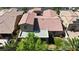 Aerial view showcases the roof, landscaping, and surrounding neighborhood with lush greenery at 4408 Oasis Plains Ave, North Las Vegas, NV 89085