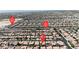 Expansive aerial view of a vibrant community with well-maintained homes and street markers at 4408 Oasis Plains Ave, North Las Vegas, NV 89085