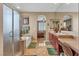 Primary bathroom with double sinks, vanity, soaking tub, large glass shower and view into the main bedroom at 4408 Oasis Plains Ave, North Las Vegas, NV 89085