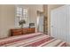 Warm and inviting bedroom with shutters, a closet, and natural light at 4408 Oasis Plains Ave, North Las Vegas, NV 89085