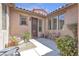 Front courtyard with desert landscaping and an outdoor seating area at 4408 Oasis Plains Ave, North Las Vegas, NV 89085