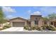 Charming single-story home featuring a two-car garage and desert landscaping at 4408 Oasis Plains Ave, North Las Vegas, NV 89085