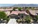 Stunning aerial view of a single-Gathering home showcasing its well-maintained exterior and landscaping at 4408 Oasis Plains Ave, North Las Vegas, NV 89085