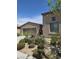 Beautiful Southwestern home with desert landscaping and a rock garden at 4408 Oasis Plains Ave, North Las Vegas, NV 89085
