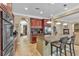 Gourmet kitchen features granite countertops, stainless appliances, and cherry wood cabinets at 4408 Oasis Plains Ave, North Las Vegas, NV 89085