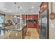 Spacious kitchen with granite countertops, stainless appliances, and cherry wood cabinets at 4408 Oasis Plains Ave, North Las Vegas, NV 89085