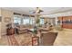 Spacious living room featuring tile flooring, neutral walls, and comfortable furniture with plush cushions at 4408 Oasis Plains Ave, North Las Vegas, NV 89085