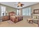 Inviting main bedroom featuring plantation shutters and traditional furnishings with a ceiling fan at 4408 Oasis Plains Ave, North Las Vegas, NV 89085