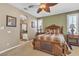 Main bedroom featuring an ensuite bathroom and traditional decor with a ceiling fan at 4408 Oasis Plains Ave, North Las Vegas, NV 89085