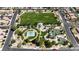 Aerial view of a well-maintained park with playground, basketball court, and green spaces at 4408 Oasis Plains Ave, North Las Vegas, NV 89085