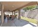 Inviting covered patio area with stylish outdoor furniture, perfect for relaxing and entertaining at 4408 Oasis Plains Ave, North Las Vegas, NV 89085
