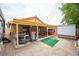 View of backyard with covered patio, hot tub, barbecue grill and storage shed at 4616 E Idaho Ave, Las Vegas, NV 89104