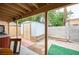This backyard features a storage shed and hot tub under a covered patio for outdoor relaxation at 4616 E Idaho Ave, Las Vegas, NV 89104