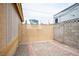 This backyard features a secure gate, gravel, and exterior wall in a low maintenance desert landscape at 4616 E Idaho Ave, Las Vegas, NV 89104