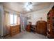 Bedroom features tiled floors, ceiling fan and multiple dressers at 4616 E Idaho Ave, Las Vegas, NV 89104