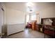 Bedroom with neutral walls, a large window, and traditional furnishings at 4616 E Idaho Ave, Las Vegas, NV 89104