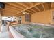 This covered patio features a hot tub with space for several people to enjoy at once at 4616 E Idaho Ave, Las Vegas, NV 89104