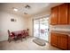 Kitchen features tiled floors, access to the backyard, lots of cabinet space and modern countertop at 4616 E Idaho Ave, Las Vegas, NV 89104