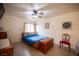 Bedroom with neutral walls, a ceiling fan, and a window that provides natural light at 4616 E Idaho Ave, Las Vegas, NV 89104