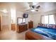 Bedroom with neutral walls, a ceiling fan, and ensuite bath at 4616 E Idaho Ave, Las Vegas, NV 89104