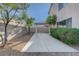 View of the backyard featuring a patio cover and mature trees at 4751 Lone Grove Dr, Las Vegas, NV 89139