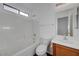 Bathroom featuring a shower, toilet, vanity, and window with natural light at 4751 Lone Grove Dr, Las Vegas, NV 89139