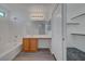 Lovely bathroom with a vanity and a built in desk area with storage, plus natural light at 4751 Lone Grove Dr, Las Vegas, NV 89139