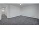 Spacious bedroom with plush gray carpeting and ample natural light throughout at 4751 Lone Grove Dr, Las Vegas, NV 89139