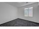 Bright bedroom with a window providing natural light and neutral carpet at 4751 Lone Grove Dr, Las Vegas, NV 89139