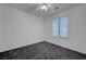 Bright bedroom features neutral walls, plush gray carpeting, and a window for natural light at 4751 Lone Grove Dr, Las Vegas, NV 89139